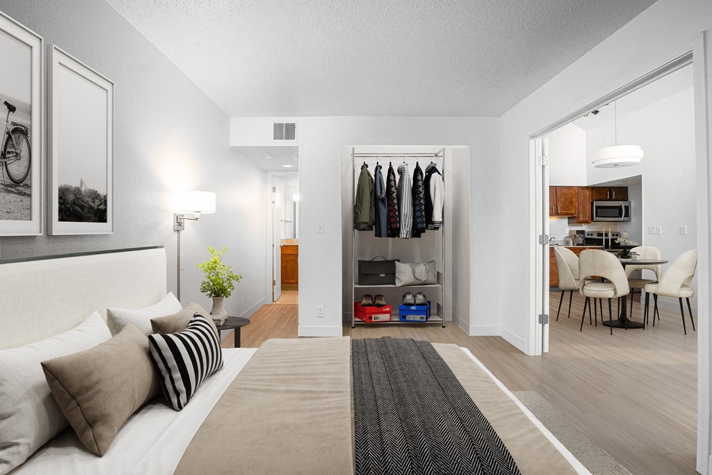 a bedroom with a bed and a closet